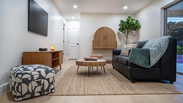 a living room with furniture and a flat screen tv