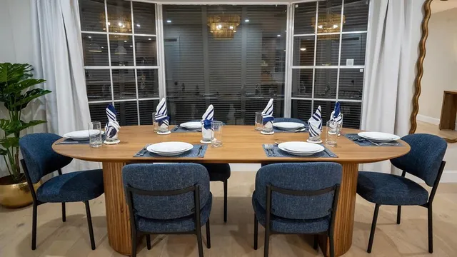 a outdoor space with a table and chairs