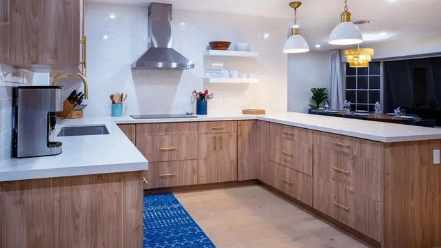 a kitchen with stainless steel appliances a sink dishwasher and a refrigerator