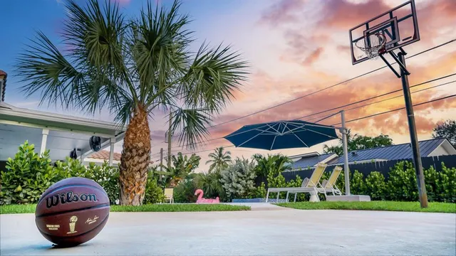 a view of a chair and table in front of a house