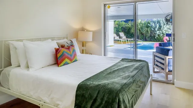 a bedroom with a bed and window