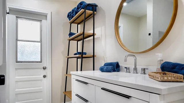a bathroom with a sink and a mirror