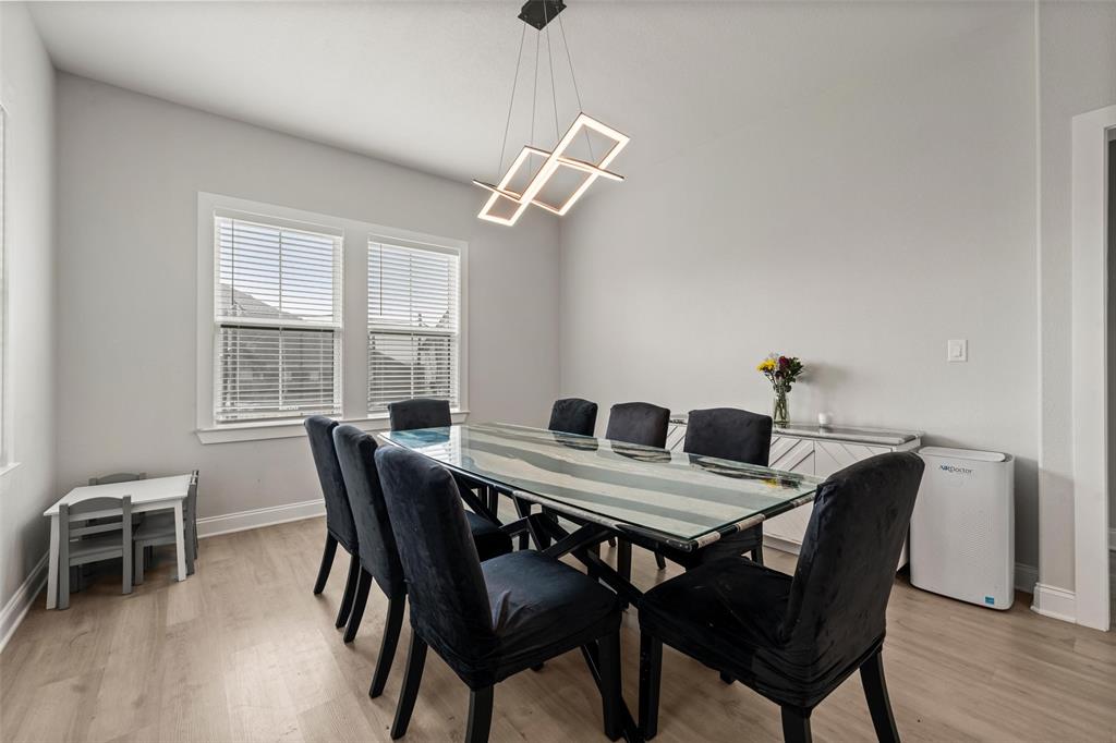 820 Forward Pass Drive Hewitt, TX 76643 - Photo 6 of 22 a view of a dining room with furniture window and wooden floor
