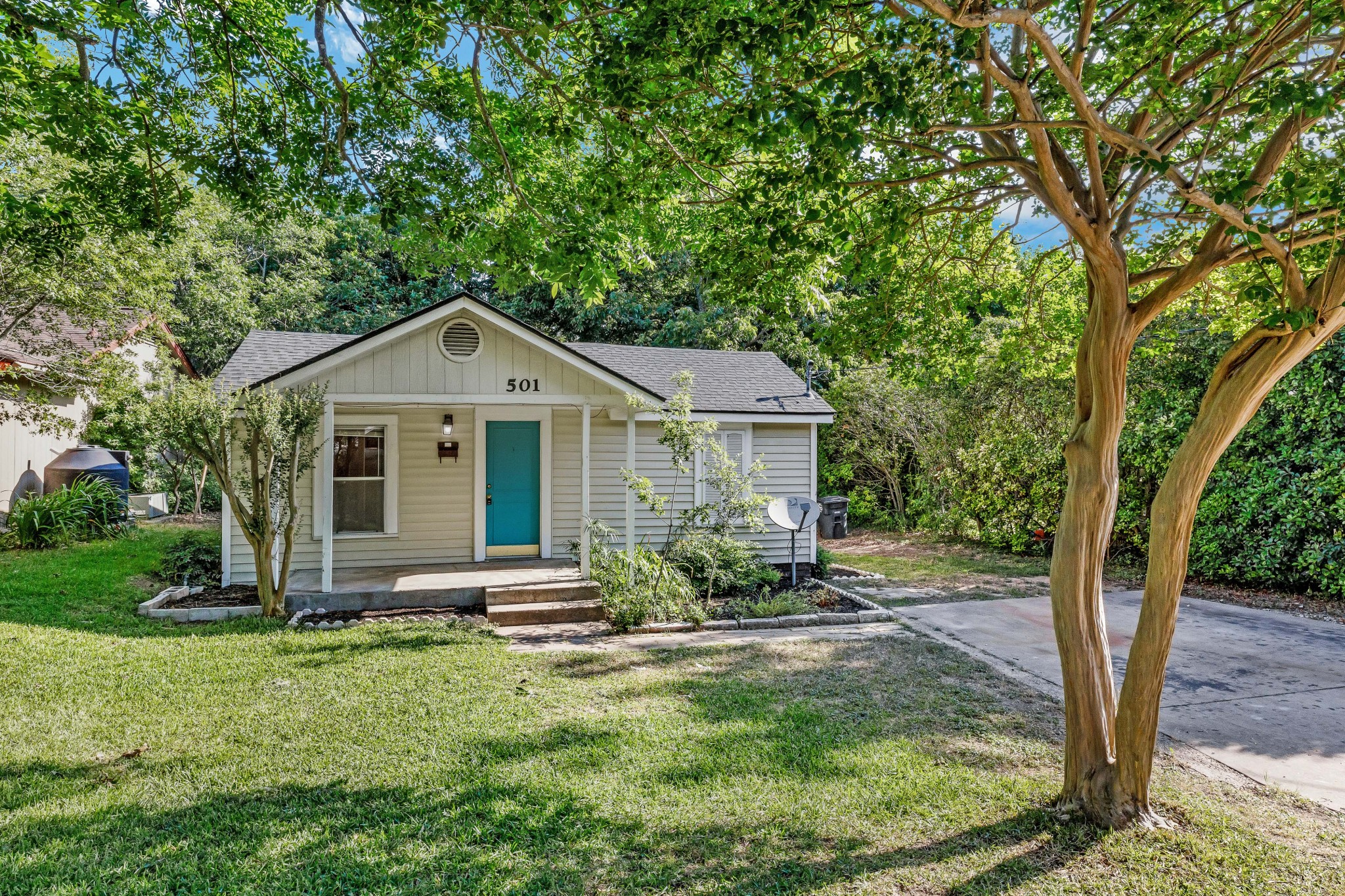 501 East 4th Street Georgetown, TX 78626 - Photo 1 of 25 View of front of property with roof with shingles, covered porch, a front lawn, and view of scattered trees