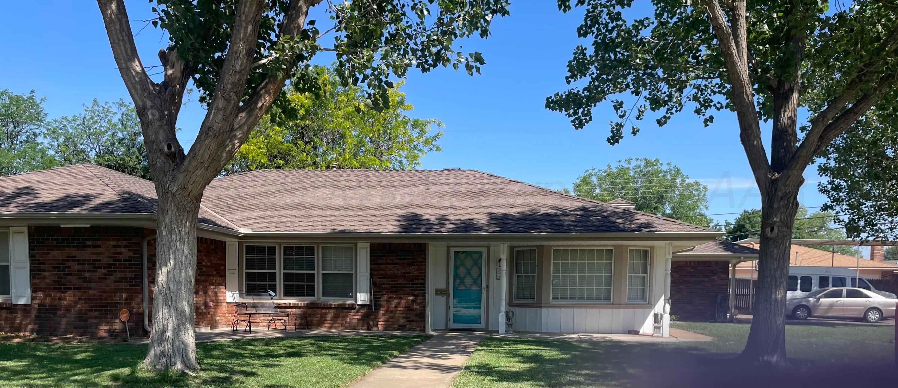 6200 Hanson Road Amarillo, TX 79106 - Photo 2 of 27 a view of a house with a tree in front of it