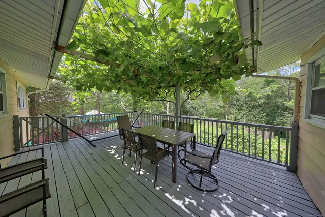 a view of a balcony with furniture