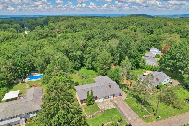 an aerial view of residential house with outdoor space