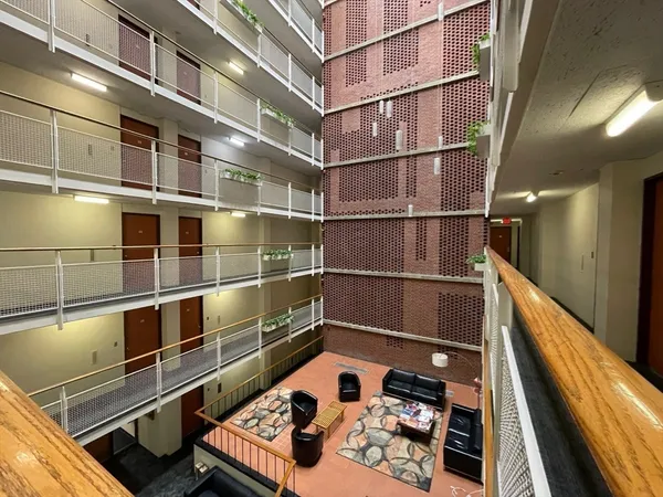 a room with storage and a potted plant on it