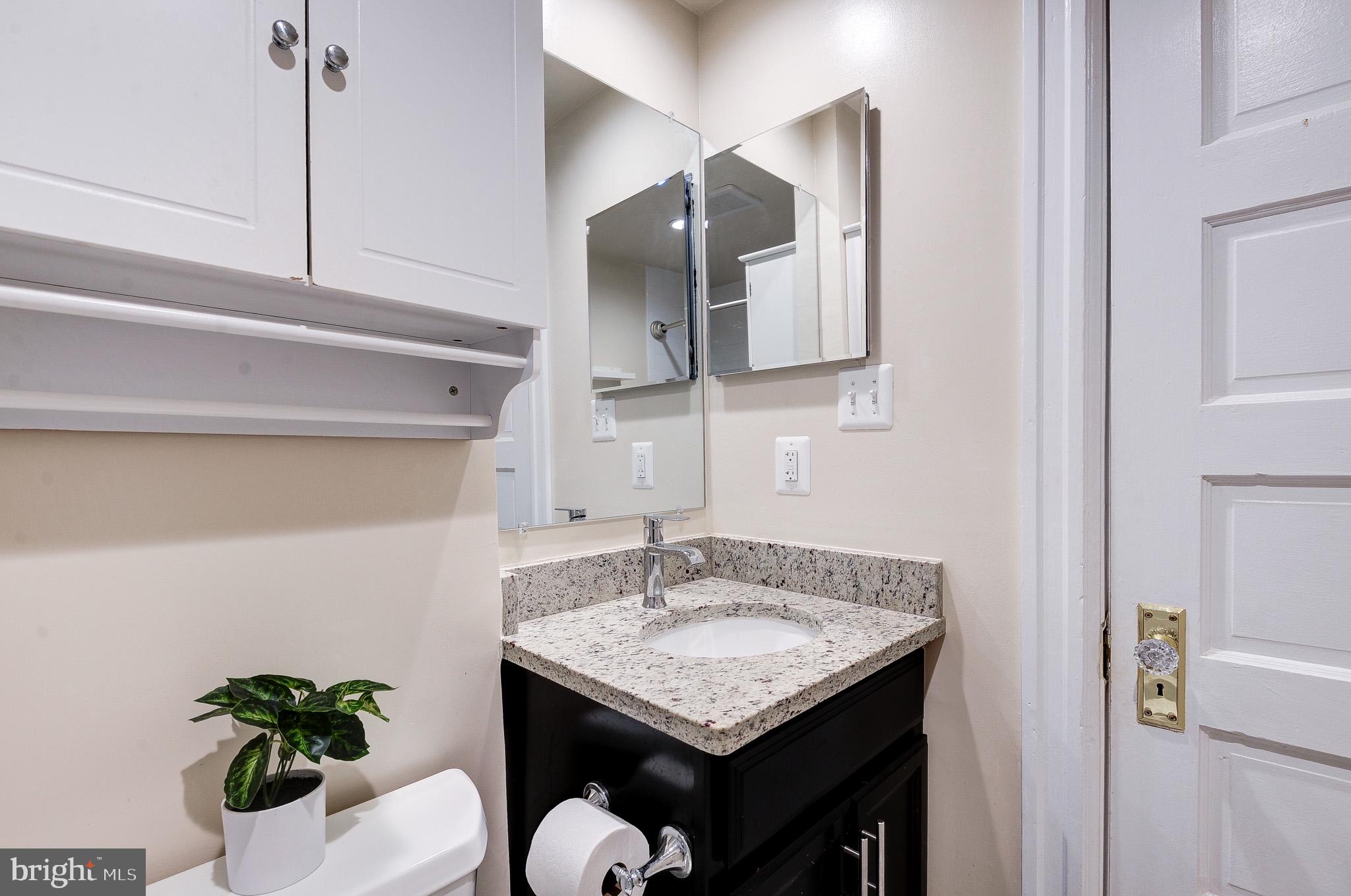 637 3rd Street Northeast, Unit 305 Washington, DC 20002 - Photo 14 of 16 Sleek bathroom with modern finishes.