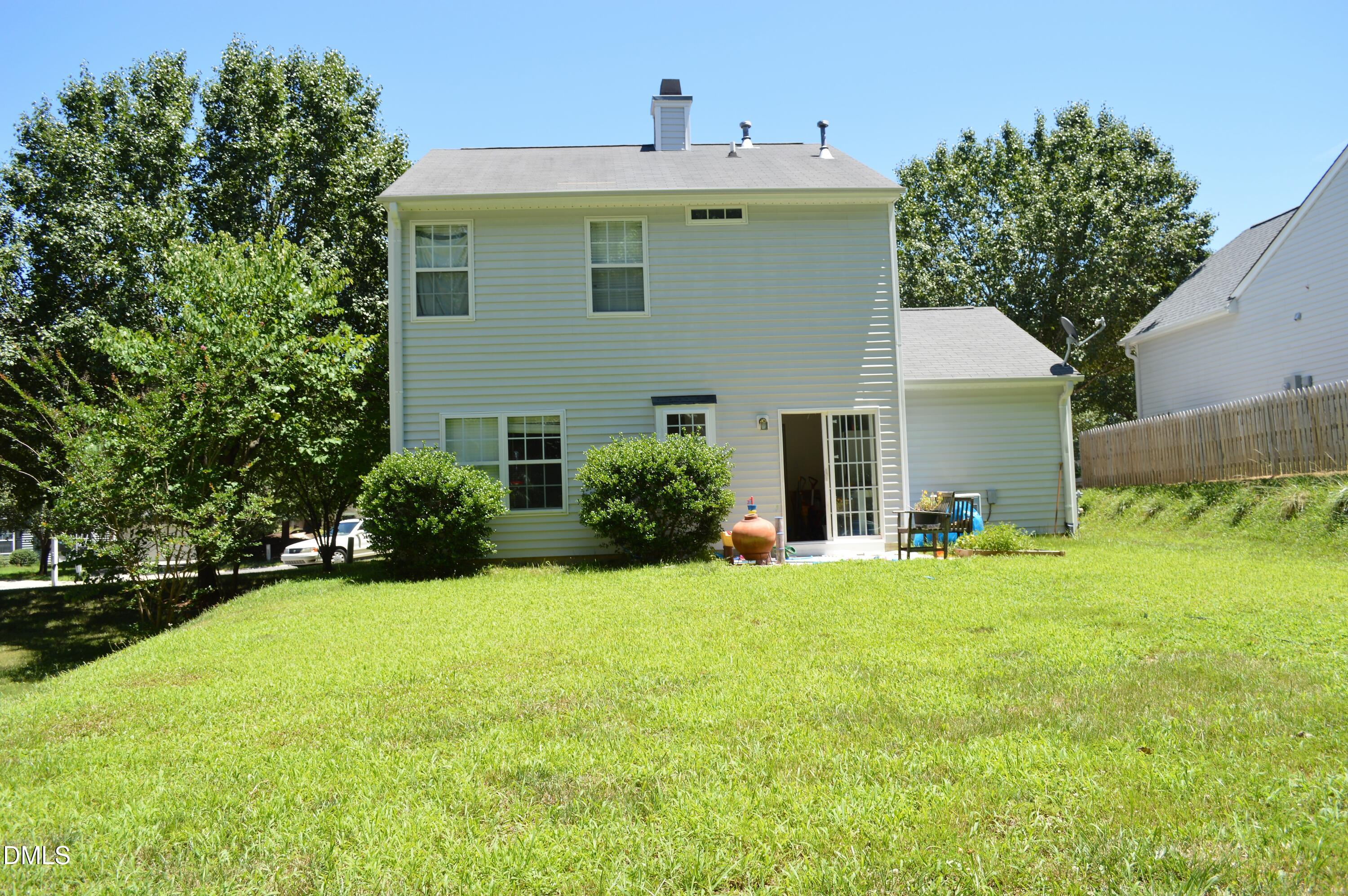 4806 Tapestry Terrace Durham, NC 27713 - Photo 17 of 18 a front view of a house with a yard