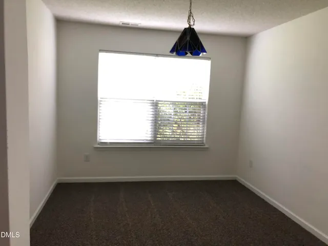 a kitchen with white cabinets stainless steel appliances and sink