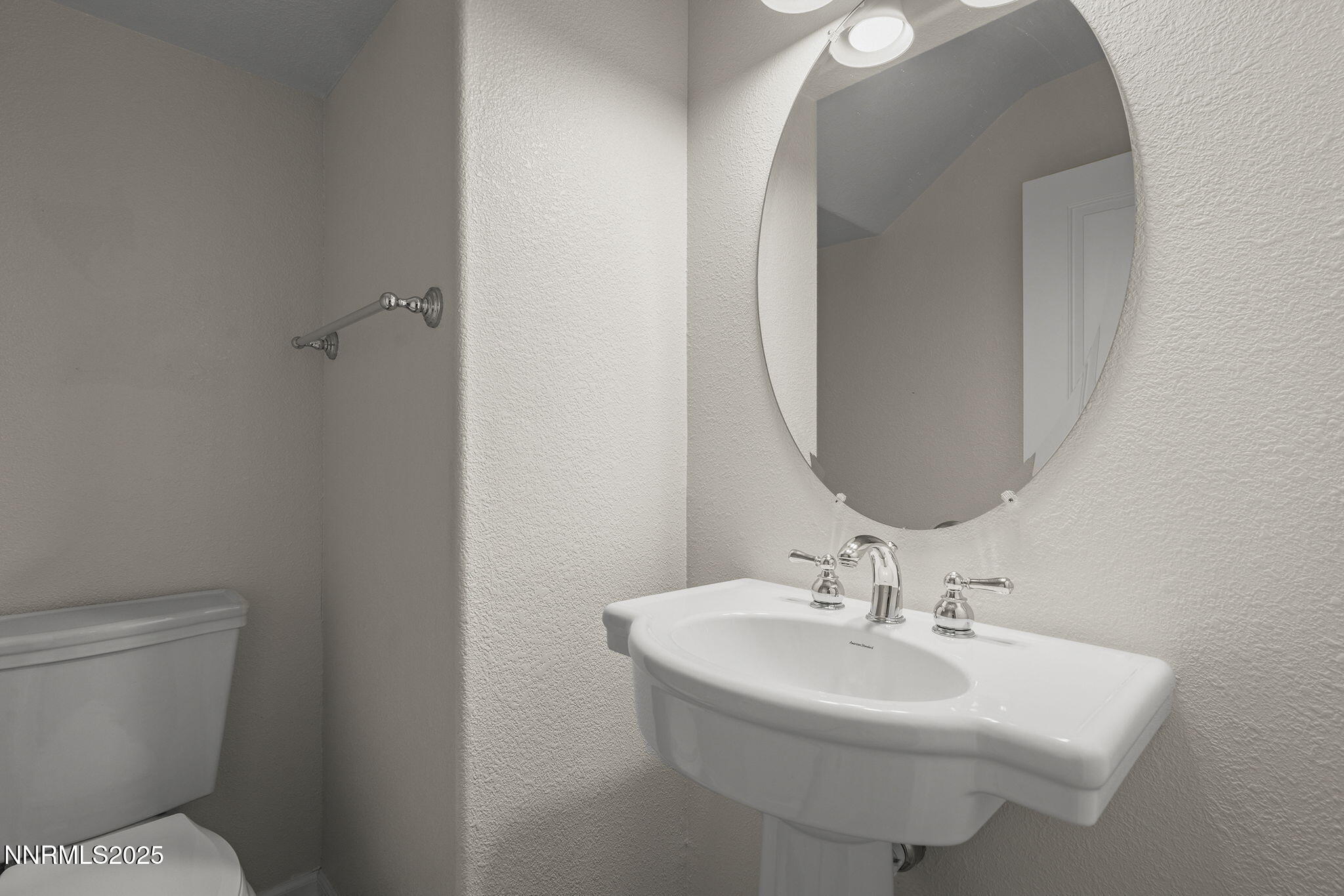 1672 Spring Hill Drive Reno, NV 89523 - Photo 12 of 26 a bathroom with a sink toilet and a mirror
