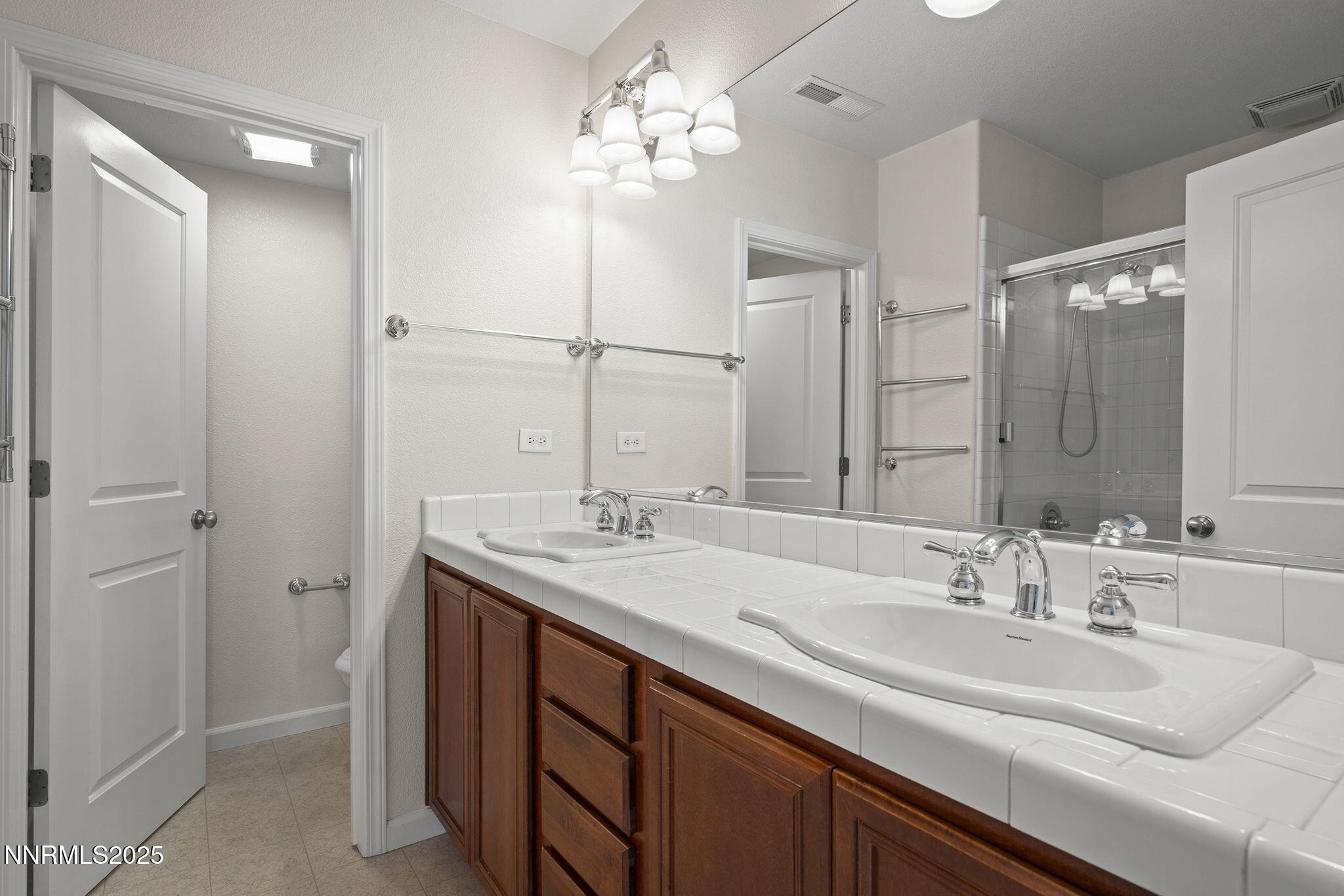 1672 Spring Hill Drive Reno, NV 89523 - Photo 17 of 26 a bathroom with a sink double vanity and a mirror