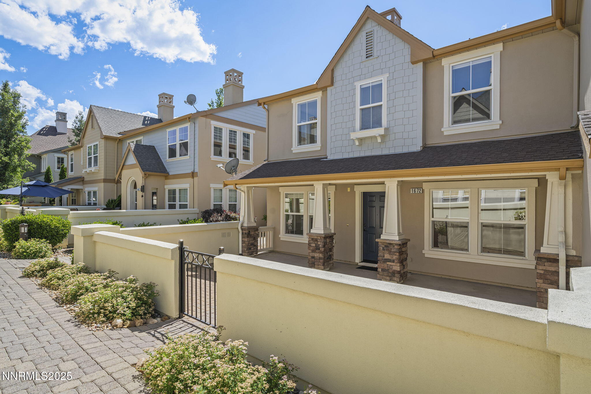 1672 Spring Hill Drive Reno, NV 89523 - Photo 2 of 26 a front view of a building with a garden view