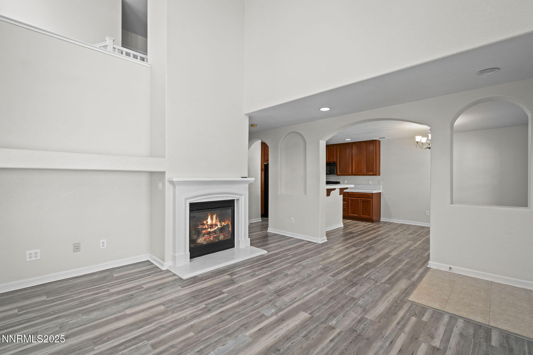 1672 Spring Hill Drive Reno, NV 89523 - Photo 7 of 26 a view of an empty room with a fireplace and a window