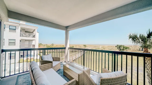 a bedroom with a bed and chandelier