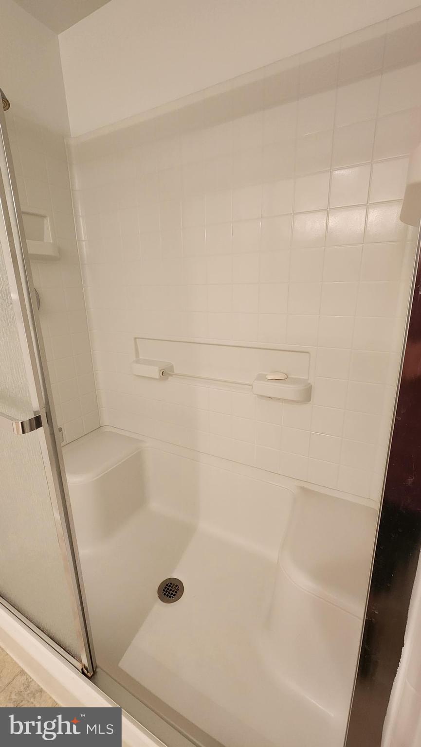 2901 South Leisure World Boulevard, Unit 303 Silver Spring, MD 20906 - Photo 14 of 54 Shower stall w/2 seats