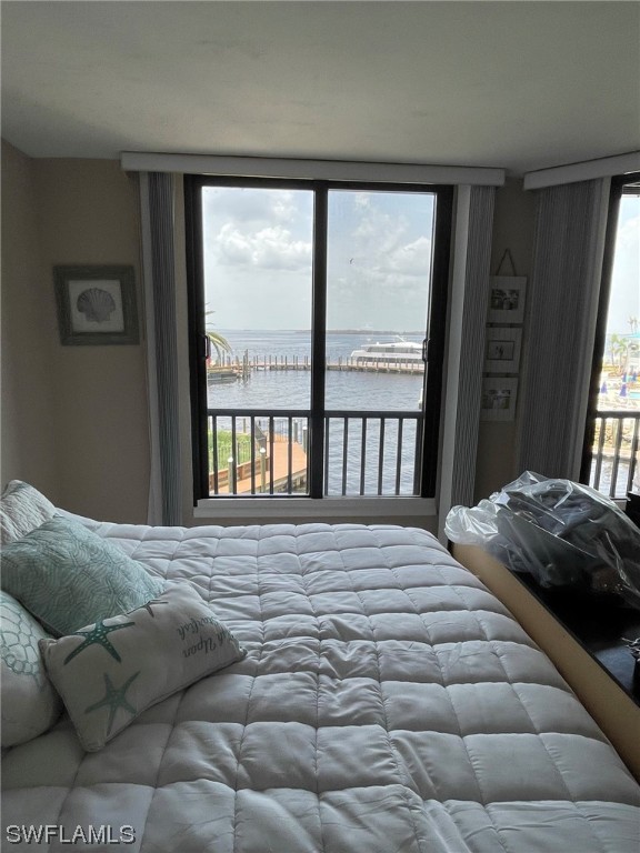 15031 Punta Rassa Road, Unit 206 Fort Myers, FL 33908 - Photo 11 of 23 a bedroom with a bed and a window