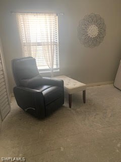 15031 Punta Rassa Road, Unit 206 Fort Myers, FL 33908 - Photo 14 of 23 a living room with furniture and a window