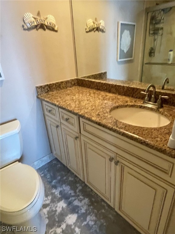 15031 Punta Rassa Road, Unit 206 Fort Myers, FL 33908 - Photo 18 of 23 a bathroom with a granite countertop sink and a mirror