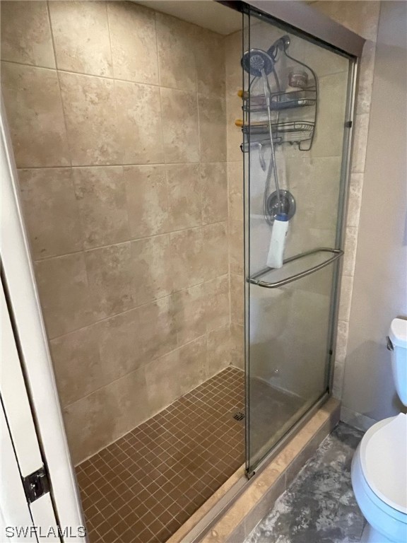 15031 Punta Rassa Road, Unit 206 Fort Myers, FL 33908 - Photo 19 of 23 a bathroom with a glass shower door