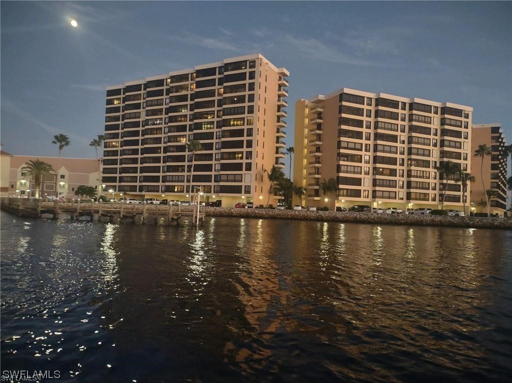 15031 Punta Rassa Road, Unit 206 Fort Myers, FL 33908 - Photo 22 of 23 a view of building with lake view