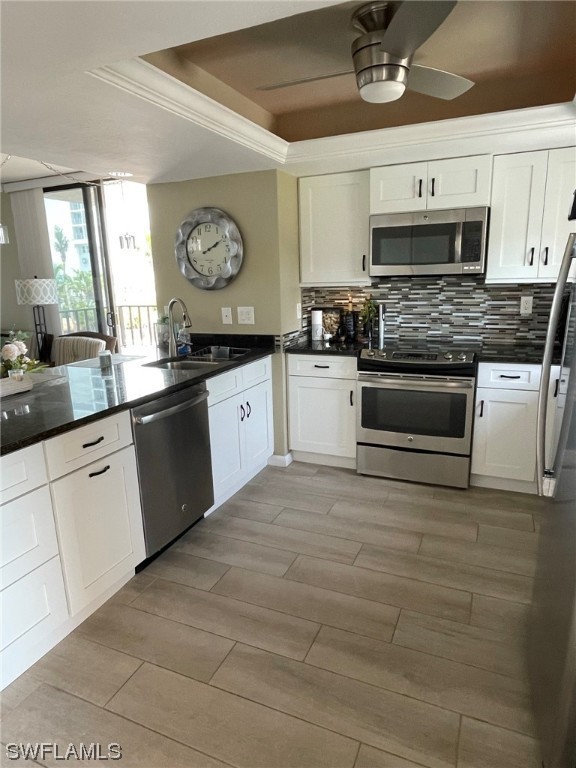 15031 Punta Rassa Road, Unit 206 Fort Myers, FL 33908 - Photo 4 of 23 a kitchen with stainless steel appliances granite countertop a stove a sink and a microwave