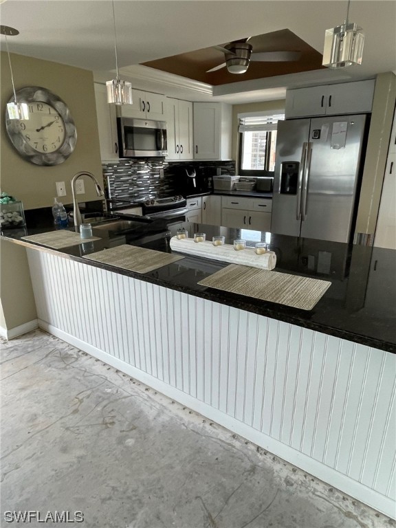 15031 Punta Rassa Road, Unit 206 Fort Myers, FL 33908 - Photo 5 of 23 a kitchen with stainless steel appliances kitchen island granite countertop a sink and cabinets
