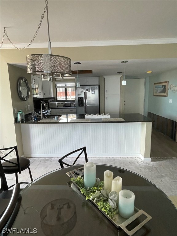 15031 Punta Rassa Road, Unit 206 Fort Myers, FL 33908 - Photo 8 of 23 a living room with furniture and chandelier