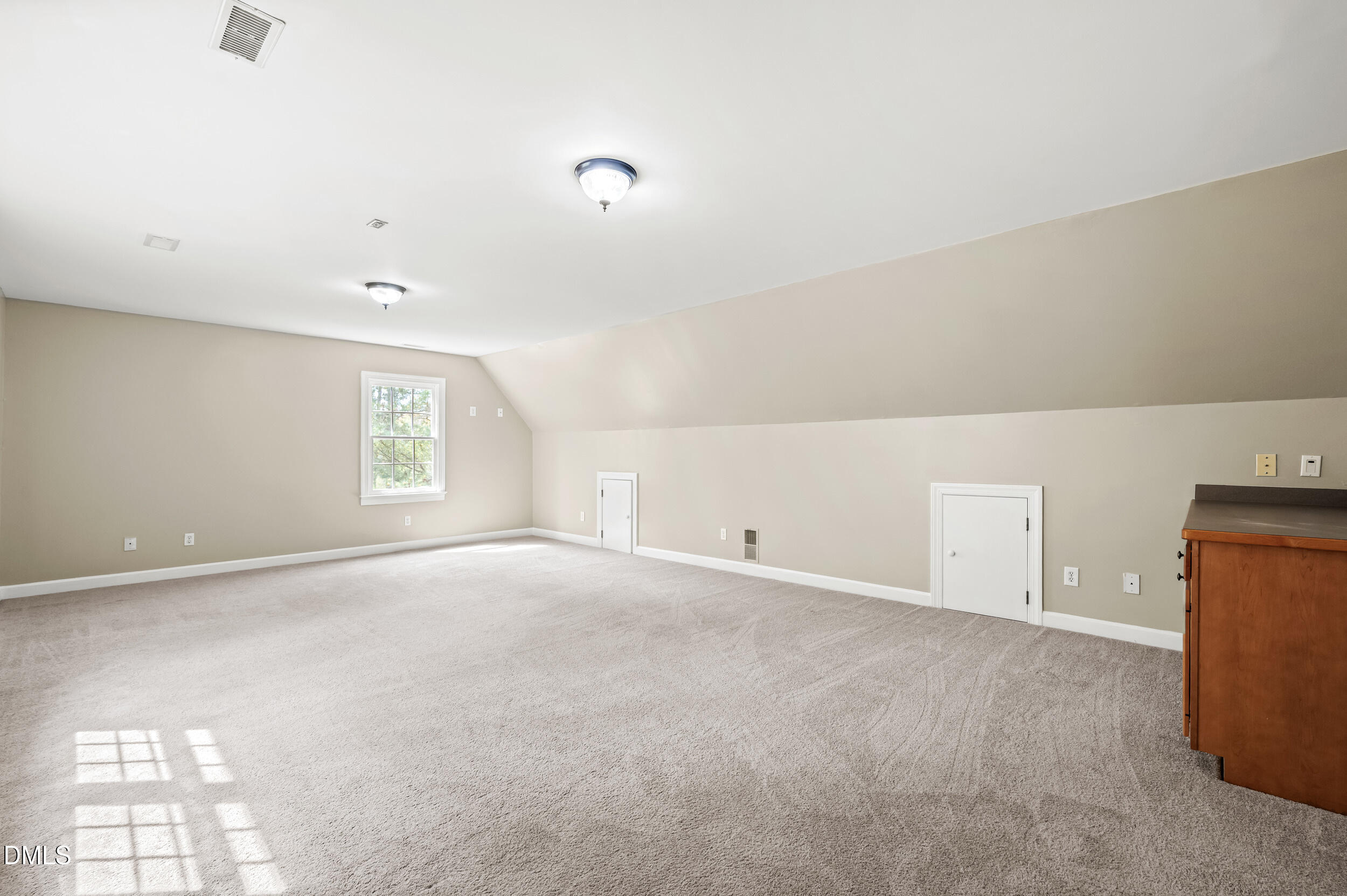 1957 Hilltop Road Raleigh, NC 27610 - Photo 29 of 46 an empty room with windows