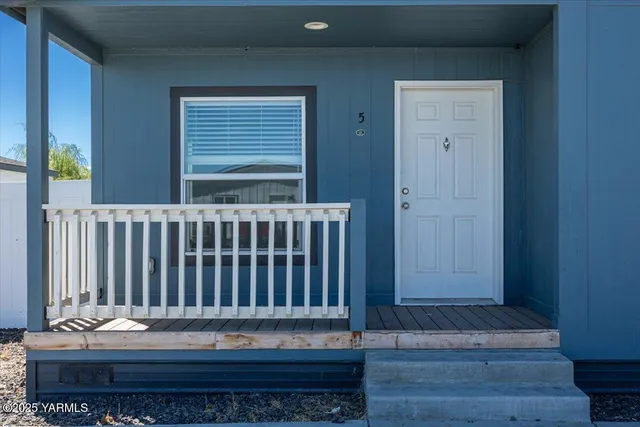 a view of a wooden door of the house
