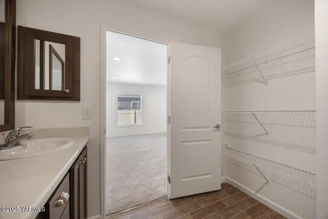 a bathroom with a sink and mirror