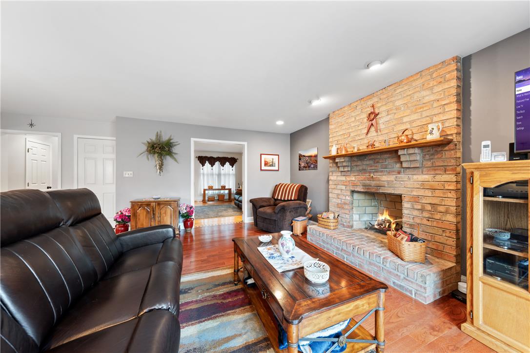 4568 Greenfield Road Bethlehem, PA 18017 - Photo 12 of 59 A comforting hearth provides warmth and a focal point within this inviting living area.
