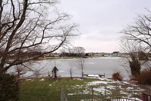 a view of swimming pool with outdoor seating and city view