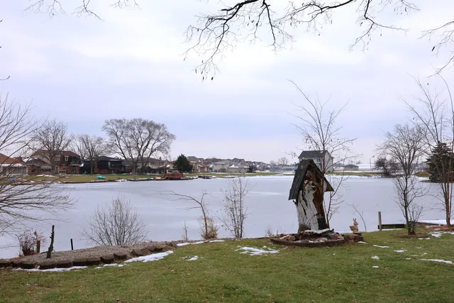 a view of a lake with a big yard