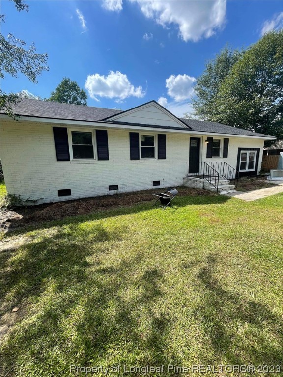 3013 Huntley Street Spring Lake, NC 28390 - Photo 1 of 8 a view of a house with a yard