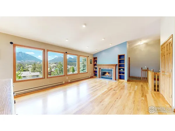 a living room with a furniture and a large window