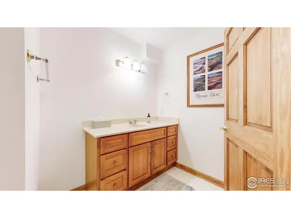 a bathroom with a sink double vanity and a tub