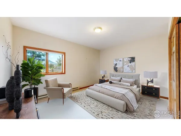 a living room with a bed furniture and a window