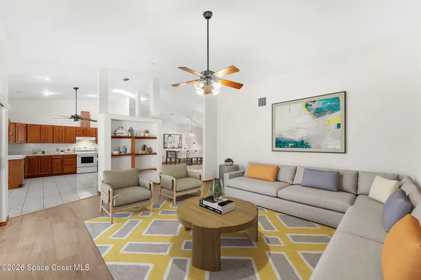 a kitchen with stainless steel appliances granite countertop a sink and a refrigerator