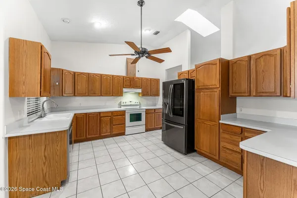 a bathroom with a sink mirror and a toilet