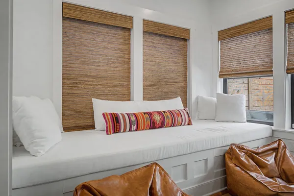 a bedroom with a couch and two couch