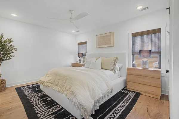 a large white bed in a white room