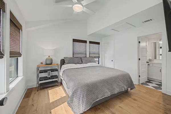 a bedroom with a bed and a window