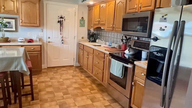 3361 Turner Drive Springfield, OH 45504 - Photo 7 of 18 This spacious kitchen offers ample cabinet storage and stainless steel appliances, creating a functional cooking space.