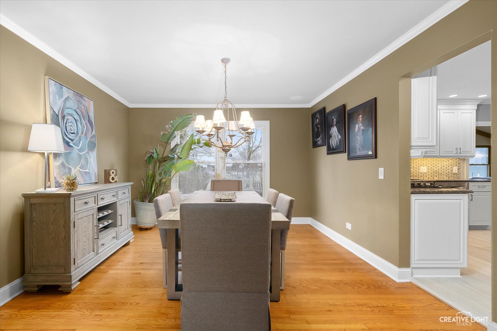 2S541 Seneca Drive Wheaton, IL 60189 - Photo 6 of 28 a living room with stainless steel appliances kitchen island granite countertop furniture and a chandelier