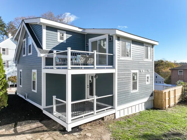 a view of a porch with wooden floor