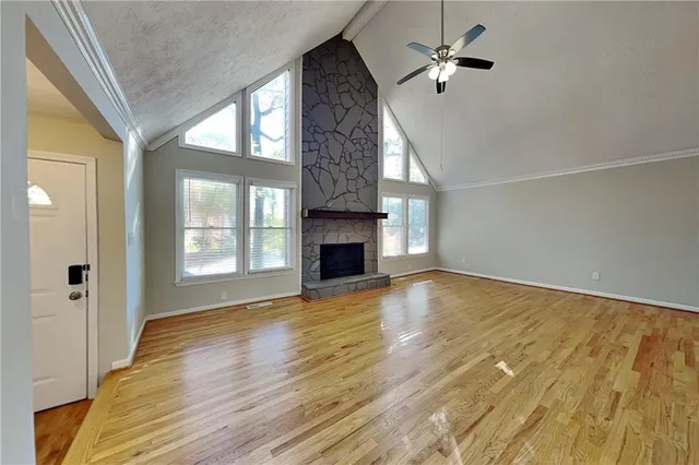 a kitchen with stainless steel appliances granite countertop a sink a stove top oven a refrigerator and dishwasher