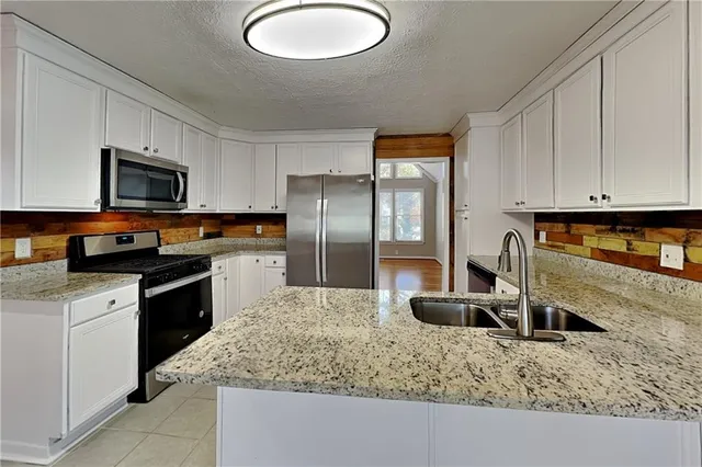 a view of a room with a wooden floor