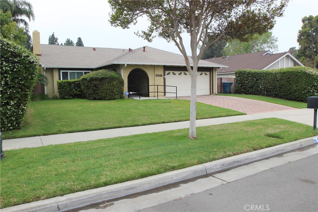 8686 Turlock Drive Riverside, CA 92504 - Photo 1 of 1 a front view of a house with a yard